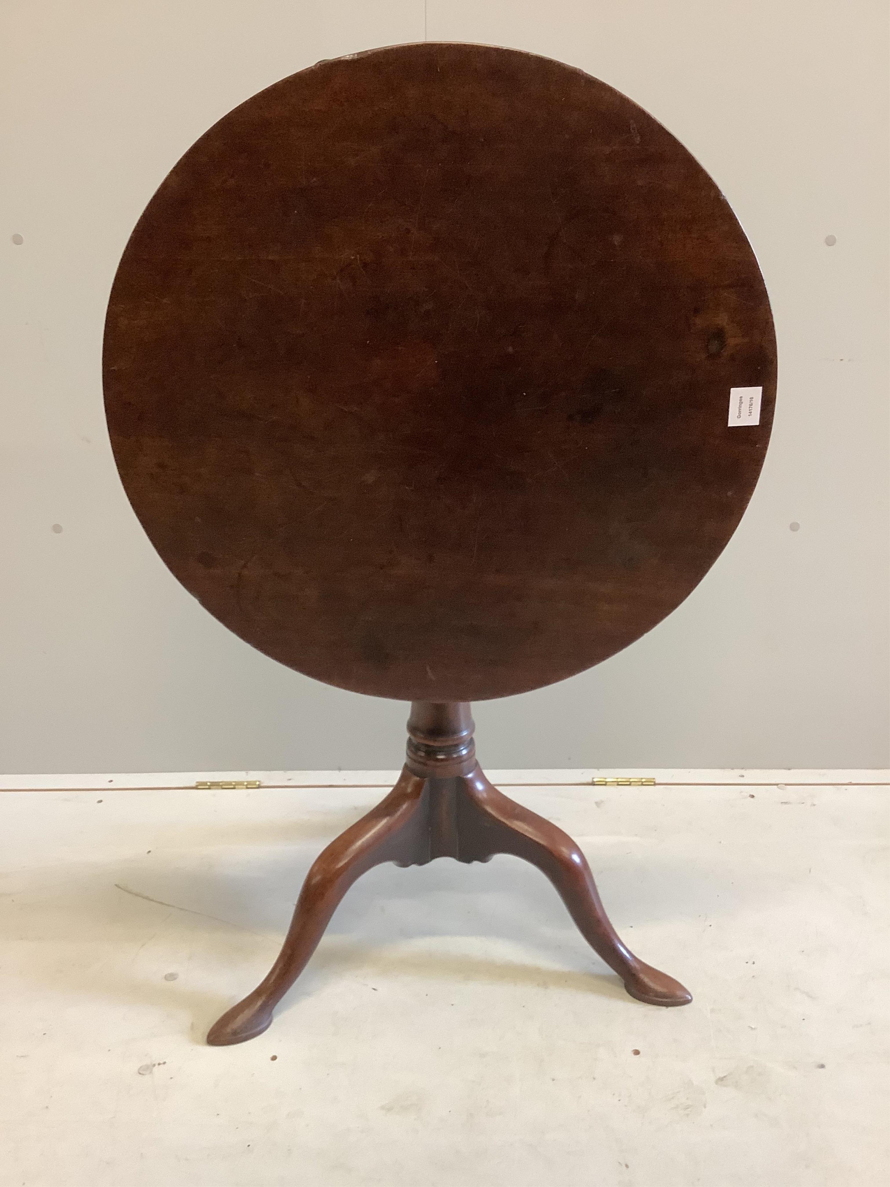 A George III circular mahogany tilt top bird cage tripod tea table, diameter 69cm, height 69cm. Condition - fair